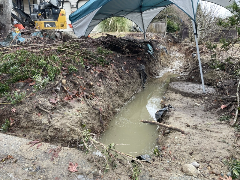 the south side trench flooded with water due to the snow melt and previous drainage system